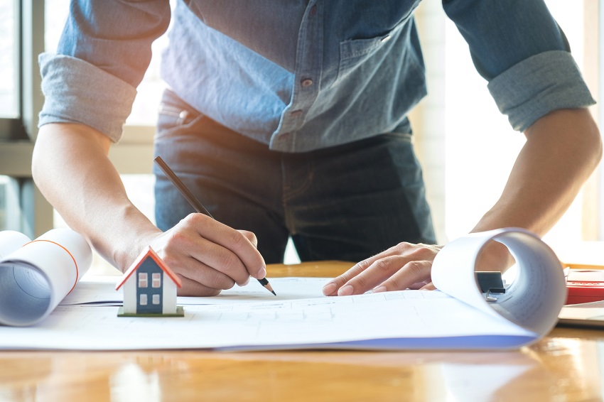 Architects are using pencil designing the house,house plan, mode